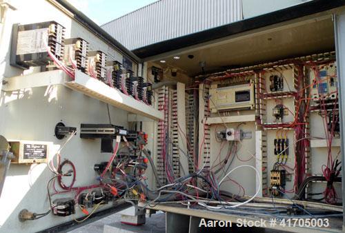 Used McNeil / NRM Profile Extrusion Line consisting of: (1) McNeil/NRM 4-1/2" single screw extruder, model 4.5 Pacemaker III32-1 RH/WC, 32 to 1 L/D ratio, electrically heated, water cooled non-vented...