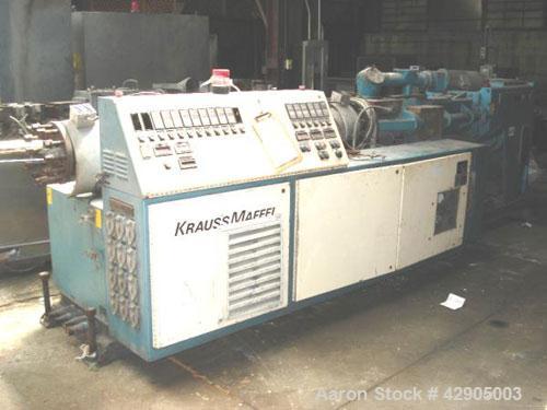 Used Krauss Maffei 110mm counter rotating twin screw extruder, model KMD-2-110Z, 110 mm screws, counter rotating, 25:1 l/d, electrically heated with 9 barrel zones, 17 die zones, 75 hp dc motor with ...