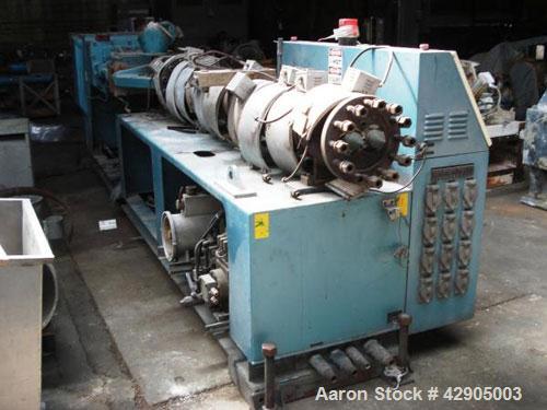 Used Krauss Maffei 110mm counter rotating twin screw extruder, model KMD-2-110Z, 110 mm screws, counter rotating, 25:1 l/d, electrically heated with 9 barrel zones, 17 die zones, 75 hp dc motor with ...