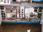 Used Krauss Maffei 110mm counter rotating twin screw extruder, model KMD-2-110Z, 110 mm screws, counter rotating, 25:1 l/d, electrically heated with 9 barrel zones, 17 die zones, 75 hp dc motor with ...