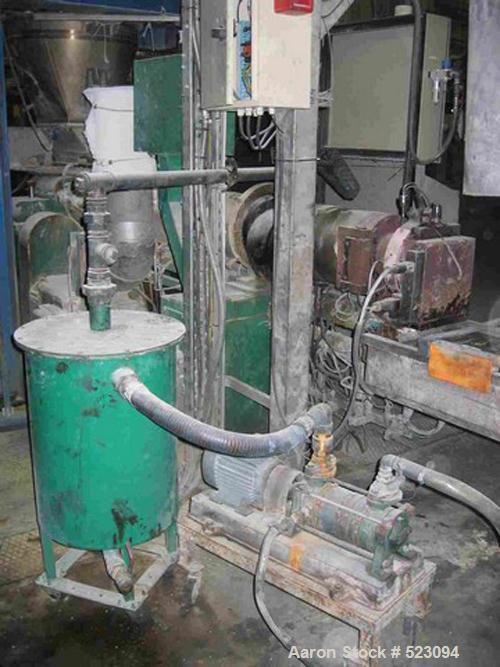 USED: Comac extrusion line. (1) Feeding system Matcon or Anag containers, servo lift Matcon (hydraulic lifting and positioning system), with 55 gallon (210 liter) Matcon buffer, screw feeder. (1) Com...