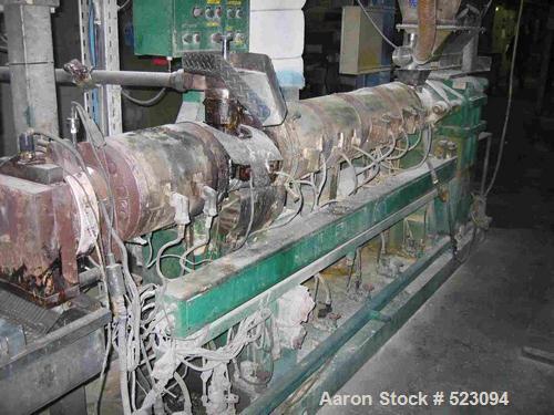 USED: Comac extrusion line. (1) Feeding system Matcon or Anag containers, servo lift Matcon (hydraulic lifting and positioning system), with 55 gallon (210 liter) Matcon buffer, screw feeder. (1) Com...