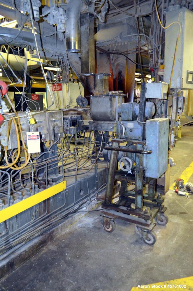 Used (1) ZSK-83 R240R 83mm Co-Rotating twin screw extruder, approximate 40 to 1 L/D ratio, serial# 218971, works# 507860-861, built 1985. (10) Barrel sections with (1) feed with hopper, (2) top vente...
