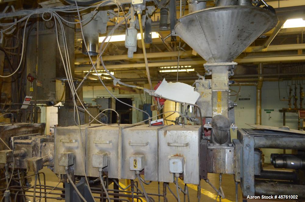 Used (1) ZSK-83 R240R 83mm Co-Rotating twin screw extruder, approximate 40 to 1 L/D ratio, serial# 218971, works# 507860-861, built 1985. (10) Barrel sections with (1) feed with hopper, (2) top vente...