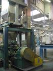 USED: Comac extrusion line. (1) Feeding system Matcon or Anag containers, servo lift Matcon (hydraulic lifting and positioning system), with 55 gallon (210 liter) Matcon buffer, screw feeder. (1) Com...