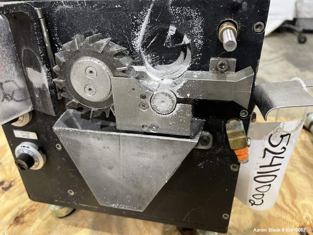 Used Brabender Lab Pelletizer, Type 7 12-74-000, 1"wide x 3-1/2" diamter cutting wheel, Approximately (20) 1/8"thick x 1/2" wide blades. Approximate 1"wide x 3/4" tall  infeed, 2" long x 1/2" wide bo...