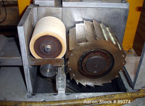 USED: Conair pelletizer, model 304. Approximately 4" wide x 20 blade helical rotor. Power feed roll with motor and VFD controller.