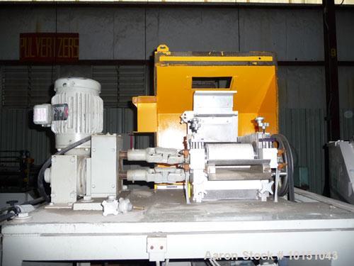 Used Conair Model T206GB Strand Pelletizer having a 6" entrance, sixteen knife rotor with removable blades. Pull rolls are driven by a 2 hp AC motor and the rotor is driven by a 5 hp AC motor. 460/3/...