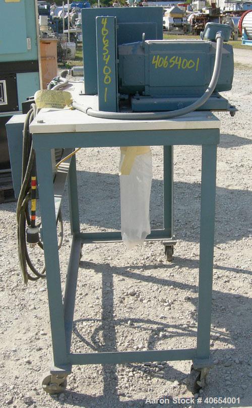 Used- Cumberland 4 Utilizer Pelletizer. 3 1/2" wide 16 bolt on blade rotor, (1) rubber, (1) metal manually adjustable pull r...