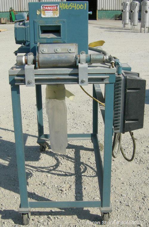 Used- Cumberland 4 Utilizer Pelletizer. 3 1/2" wide 16 bolt on blade rotor, (1) rubber, (1) metal manually adjustable pull r...