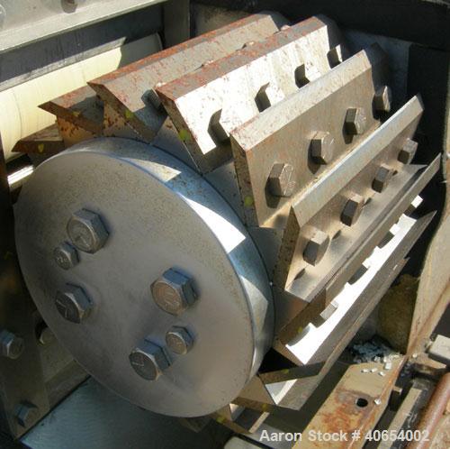 Used Cumberland 6 Pelletizer. 6 5/8" wide 16 bolt on blade rotor, (1) rubber, (1) metal manually adjustable pull roll.  Driven by a 5 hp, 3/60/230/460 volt, 1750 rpm varispeed motor, ratio 1.82 to 1,...