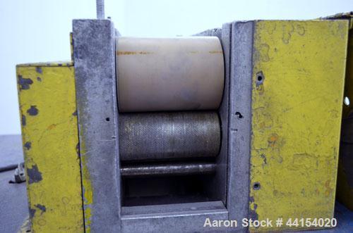 Used Wayne Pelletizer. Approximate 4" wide x 6" diameter (12) bolt on blade rotor. (1) Rubber, (1) metal pull rolls. Driven by an approximate 5hp motor. Includes a Focus 2 DC drive. Mounted on a fram...