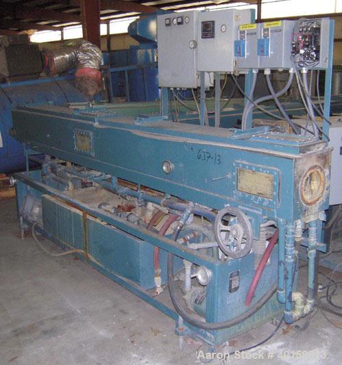 Used RDN Vacuum Sizing Tank, Model 4D2V2T12, stainless steel. 12" wide x 12" deep x 12' long. (2) sections. Includes holding tank and pump. Mounted on a carbon steel frame with casters.