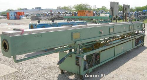 Used RDN Vacuum Sizing Tank, model 4D2V2T24, 304 stainless steel. 12" wide x 12" deep x 24' long. (4) sections with covers.  Includes holding tank, heat exchangers and pumps. Mounted on a carbon stee...