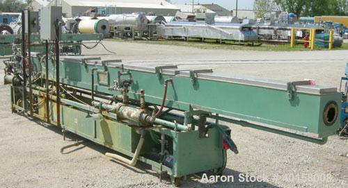 Used RDN Vacuum Sizing Tank, model 4D2V2T24, 304 stainless steel. 12" wide x 12" deep x 24' long. (4) sections with covers.  Includes holding tank, heat exchangers and pumps. Mounted on a carbon stee...