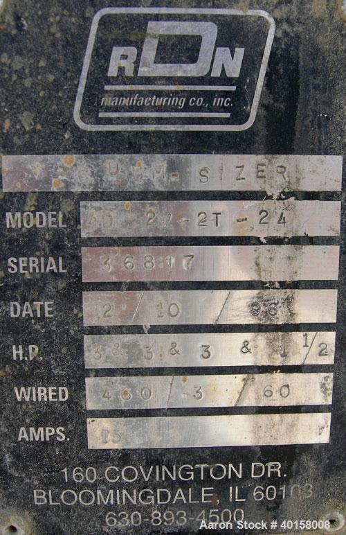Used RDN Vacuum Sizing Tank, model 4D2V2T24, 304 stainless steel. 12" wide x 12" deep x 24' long. (4) sections with covers.  Includes holding tank, heat exchangers and pumps. Mounted on a carbon stee...