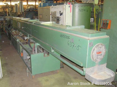 Used RDN Vacuum Sizing Tank, Model 4D3V2T30, stainless steel. 12" wide x 12" deep x 30' long. (5) sections with covers. Includes holding tank and pumps. Mounted on a carbon steel frame with casters.