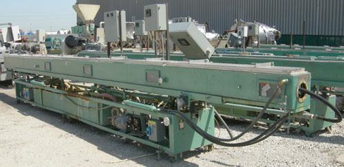 Used RDN Vacuum Sizing Tank, Model 4D3V2T30, 304 stainless steel. 12" wide x 12" deep x 30' long. (5) sections with covers.  Includes holding tank, heat exchangers and pumps. Mounted on a carbon stee...