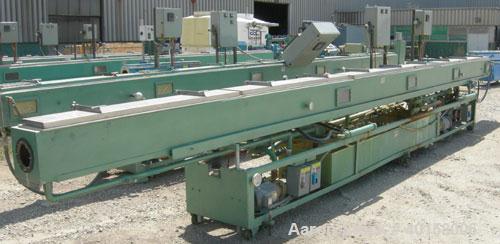 Used RDN Vacuum Sizing Tank, Model 4D3V2T30, 304 stainless steel. 12" wide x 12" deep x 30' long. (5) sections with covers.  Includes holding tank, heat exchangers and pumps. Mounted on a carbon stee...