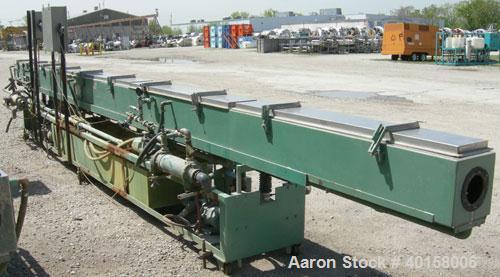 Used RDN Vacuum Sizing Tank, Model 4D3V2T30, 304 stainless steel. 12" wide x 12" deep x 30' long. (5) sections with covers.  Includes holding tank, heat exchangers and pumps. Mounted on a carbon stee...