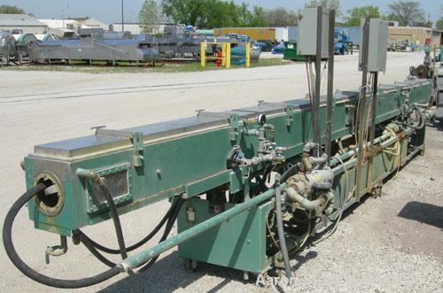 Used RDN Vacuum Sizing Tank, Model 4D3V2T30, 304 stainless steel. 12" wide x 12" deep x 30' long. (5) sections with covers.  Includes holding tank, heat exchangers and pumps. Mounted on a carbon stee...