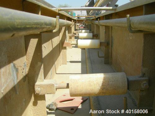 Used RDN Vacuum Sizing Tank, Model 4D3V2T30, 304 stainless steel. 12" wide x 12" deep x 30' long. (5) sections with covers.  Includes holding tank, heat exchangers and pumps. Mounted on a carbon stee...