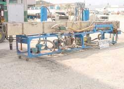 USED:Vacuum sizing tank, stainless steel. 14" wide x 14" deep x 20'long. 4 sections. Unit includes (2) 1 hp MP pumps, (2) 5 hp vacuumpumps.