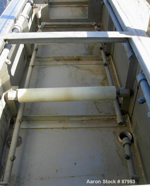 Used Custom Downstream Systems Vacuum Sizing Tank, Model CVS-20-16-20, 304 stainless steel. (4) Sections, 16" wide x 20" deep x 240" long. Plexiglass top covers. Includes holding tank, heat exchanger...