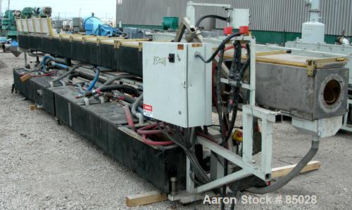 USED: Custom Downstream System vacuum sizing tank, model CVS12-30-LEFT, 304 stainless steel. 12" wide x 12" deep x 30' long. Includes holding tank, heat exchanger, pumps, panel and covers. Mounted on...