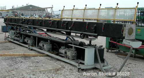 USED: Custom Downstream System vacuum sizing tank, model CVS12-30-LEFT, 304 stainless steel. 12" wide x 12" deep x 30' long. Includes holding tank, heat exchanger, pumps, panel and covers. Mounted on...