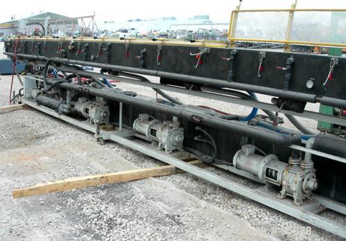 USED: Custom Downstream System vacuum sizing tank, model CVS12-30-LEFT, 304 stainless steel. 12" wide x 12" deep x 30' long. Includes holding tank, heat exchanger, pumps, panel and covers. Mounted on...