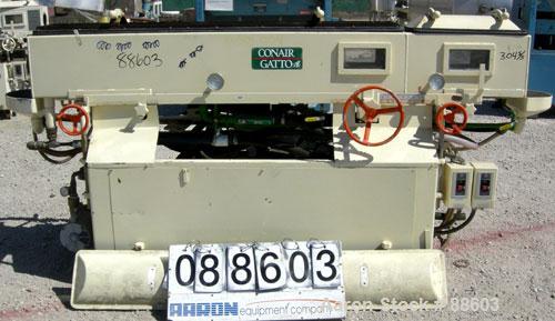 USED: Conair/Gatto vacuum sizing tank, model DPC-105C-8-2, 304 stainless steel, 12" wide x 12" deep x 8' long. (2) Section with plastic covers. Includes holding tank, heat exchanger, centrifugal pump...