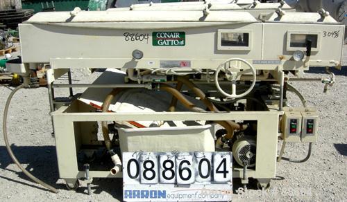 USED: Conair/Gatto vacuum sizing tank, model DPC-105C-8-2, 304 stainless steel, 12" wide x 12" deep x 8' long. (2) Section with plastic covers. Includes holding tank and centrifugal pump. Mounted on ...