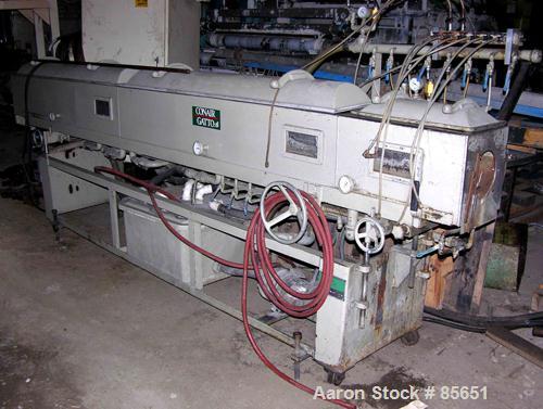 Used Conair Vacuum Sizer, Model DPC-107C, Stainless Steel. 14' Long, 7.5" maximum opening, 14" x 14" chamber, (1) 2', (2) 6' long chambers, on base with 3 hp vacuum pump, water circulation system wit...