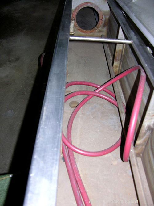 Used Conair Vacuum Sizer, Model DPC-107C, Stainless Steel. 14' Long, 7.5" maximum opening, 14" x 14" chamber, (1) 2', (2) 6' long chambers, on base with 3 hp vacuum pump, water circulation system wit...