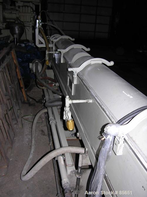 Used Conair Vacuum Sizer, Model DPC-107C, Stainless Steel. 14' Long, 7.5" maximum opening, 14" x 14" chamber, (1) 2', (2) 6' long chambers, on base with 3 hp vacuum pump, water circulation system wit...