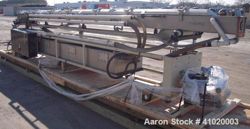 Used Conair Vacuum Sizing Tank, Model MT104-22-5, 304 Stainless Steel. 12" wide x 265" long x 7" deep. Includes a holding tank and pumps. Mounted on a carbon steel frame on casters.