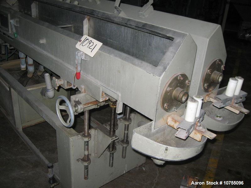 Used Conair Stainless Steel Vacuum Tank 12' long x 8" wide x 8" tall.  Fiberglass lids, sightglasses, manual independent height and side to side adjustable, mounted on carbon steel frame with casters...
