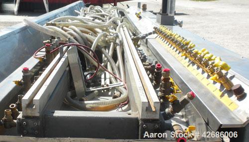 Used Crown Vacuum Calibrating Table, Model CMZDY. Stainless steel pan 24" wide x 231" long x approximately 3-3/4" deep. 2. The dies are connected with aluminum alloy “T” guiding rails and bolts. Incl...