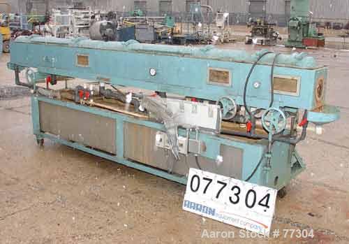 USED: Gatto vacuum sizing tank, model DPC-105B-14-3, stainless steel,12" wide x 12" deep x 14' long. 3 section with covers. 5-1/2" diameterend openings. Includes holding tank, heat exchanger, 5 hp va...