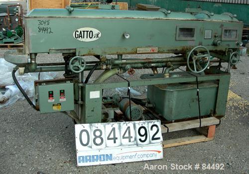 Used Gatto Vacuum Sizing Tank, Model DPC-105C82, Stainless Steel. 12" Wide x 12" deep x 96" long. (2) Sections with covers. 5-1/2" Diameter end openings. Includes holding tank and 2 pumps. Mounted on...
