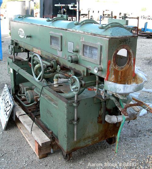 Used Gatto Vacuum Sizing Tank, Model DPC-105C82, Stainless Steel. 12" Wide x 12" deep x 96" long. (2) Sections with covers. 5-1/2" Diameter end openings. Includes holding tank and 2 pumps. Mounted on...