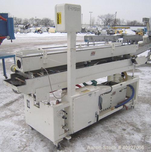 Used RDN Vacuum Sizer Tank, 304 Stainless Steel. 6" wide x 96" long x 6" deep, with holding tank, pump, and heat exchanger. Includes control panel, mounted on a carbon steel frame with casters, seria...