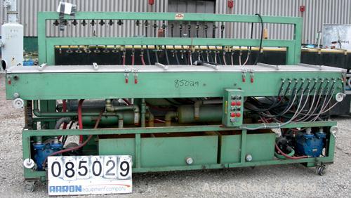 USED: RDN vacuum sizing tank, 304 stainless steel. 20" wide x 9" deep x 12' long. Includes holding tank, heat exchanger, pumps, panel and covers. Mounted on a carbon steel frame.