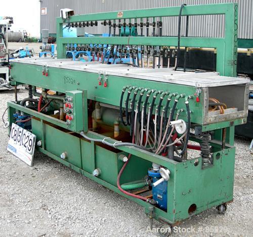 USED: RDN vacuum sizing tank, 304 stainless steel. 20" wide x 9" deep x 12' long. Includes holding tank, heat exchanger, pumps, panel and covers. Mounted on a carbon steel frame.