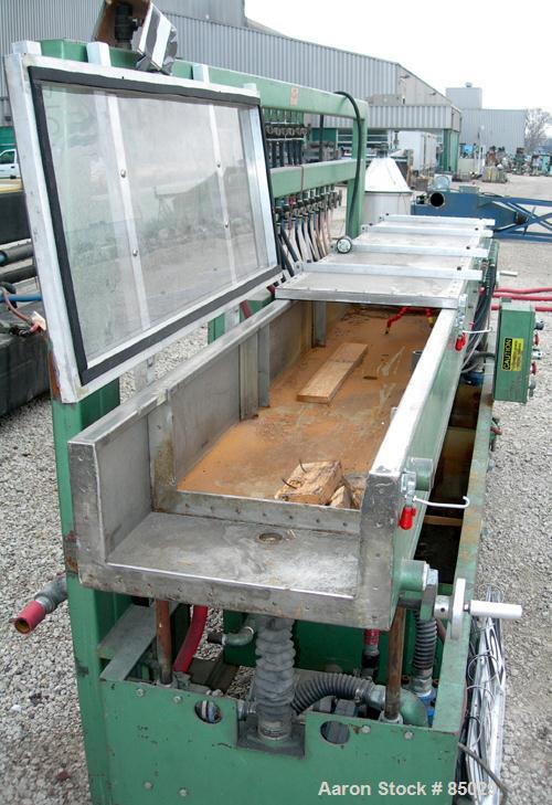 USED: RDN vacuum sizing tank, 304 stainless steel. 20" wide x 9" deep x 12' long. Includes holding tank, heat exchanger, pumps, panel and covers. Mounted on a carbon steel frame.