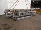 Used Battenfeld 24’’ Maximum Diameter PVC Pipe Extrusion Line. Consisting of: (1) Battenfeld 168 mm counter-rotating twin screw extruder, model BEX-2-168/28, serial# 9621-61, built 2000. Electrically...