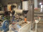 Used PRT Recycling Line.  Maximum output 1322 lbs/hour (600 kilos/hour).  Motor 268 hp (200 kW).  Line comprised of (1) single screw extruder 4.9