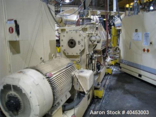 Used PTI (2004) multi layer sheet extrusion line including the following: A) (1) Used PTI model 6000 Trident series 6", 28:1 extruder having a 7-zone electrically heated air cooled barrel at an appro...