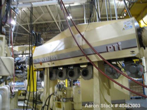 Used PTI (2004) multi layer sheet extrusion line including the following: A) (1) Used PTI model 6000 Trident series 6", 28:1 extruder having a 7-zone electrically heated air cooled barrel at an appro...